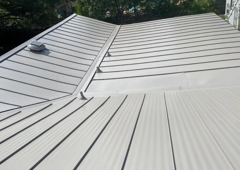 Solar attic fan installed on a metal roof for Roof Ventilation in Walnut Creek